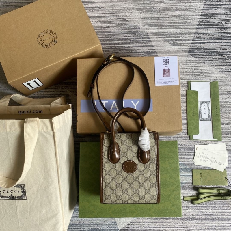G*u*i shopping bags